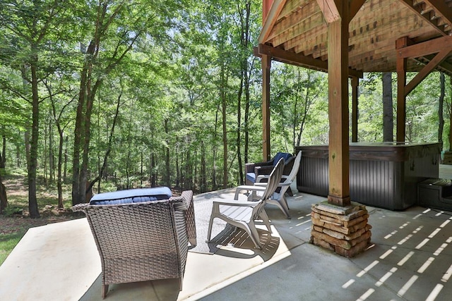 9250-11 River Rd, Fortson, GA 31808 - view of patio / terrace featuring a hot tub and a view of trees