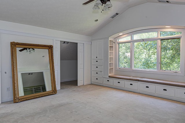 9250-11 River Rd, Fortson, GA 31808 - unfurnished bedroom with vaulted ceiling, light colored carpet, and a ceiling fan