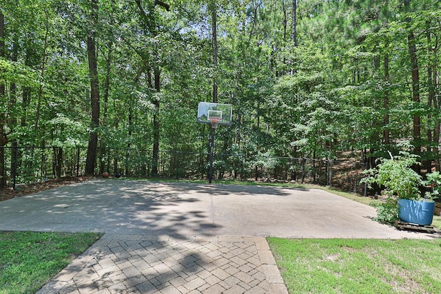 9250-11 River Rd, Fortson, GA 31808 - view of patio with basketball hoop and a wooded view