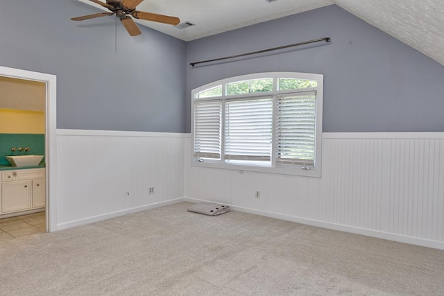 9250-11 River Rd, Fortson, GA 31808 - unfurnished bedroom with lofted ceiling, wainscoting, carpet floors, and ensuite bath