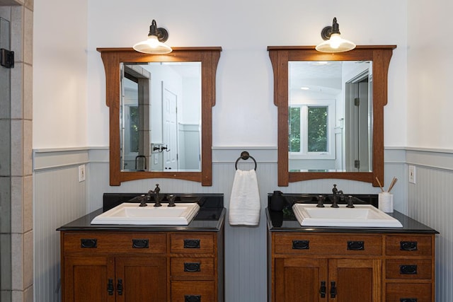 9250-11 River Rd, Fortson, GA 31808 - bathroom with two vanities, wainscoting, and a decorative wall