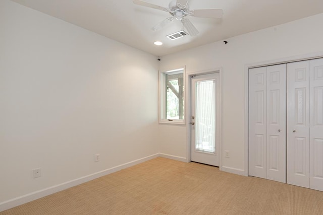 9250-11 River Rd, Fortson, GA 31808 - unfurnished bedroom with light colored carpet, a closet, and ceiling fan
