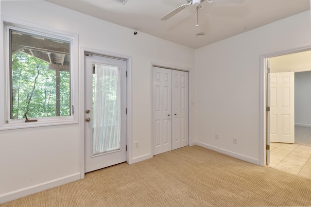 9250-11 River Rd, Fortson, GA 31808 - unfurnished bedroom with light carpet, access to exterior, and ceiling fan