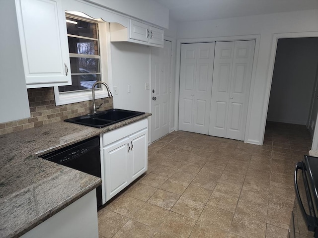 kitchen featuring backsplash, sink, stone counters, dishwasher, and white cabinets