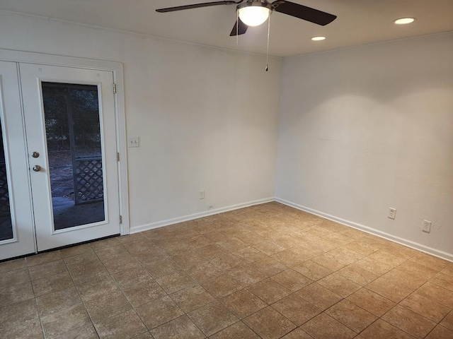 unfurnished room with ceiling fan and french doors