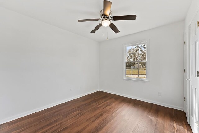 unfurnished bedroom featuring a closet, ceiling fan, and dark hardwood / wood-style flooring