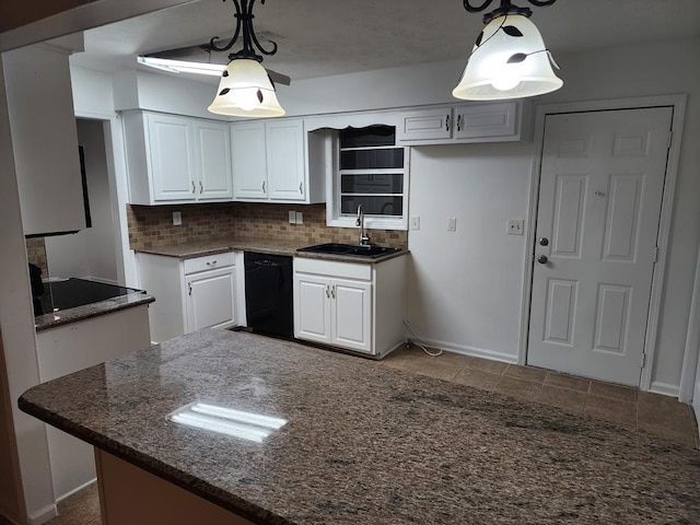 kitchen with sink, decorative backsplash, black dishwasher, decorative light fixtures, and white cabinetry