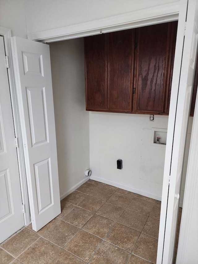 laundry area with cabinets and hookup for a washing machine