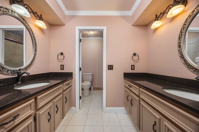 bathroom with ornamental molding, two vanities, a sink, and tile patterned floors