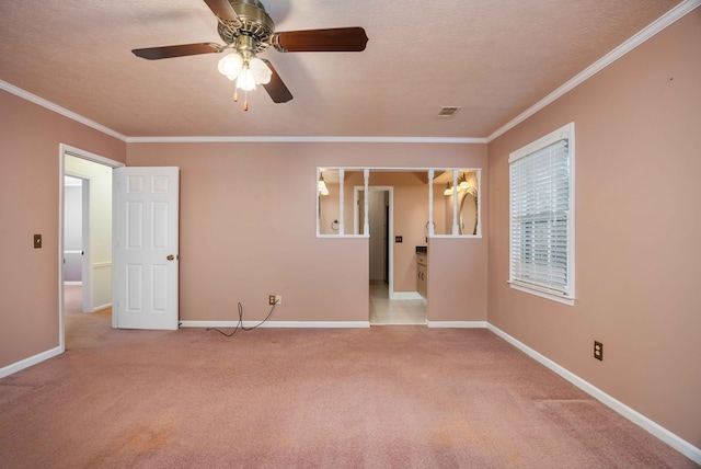 7015 Widgeon Dr, Midland, GA 31820 - unfurnished room featuring carpet flooring, ornamental molding, baseboards, ceiling fan, and a textured ceiling