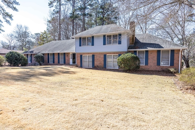 7015 Widgeon Dr, Midland, GA 31820 - tri-level home featuring brick siding, a chimney, and roof with shingles