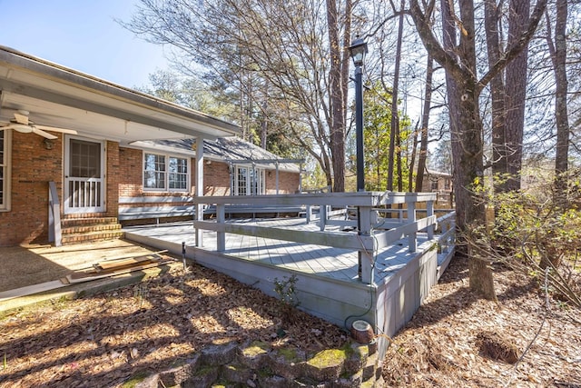 deck featuring entry steps and a ceiling fan