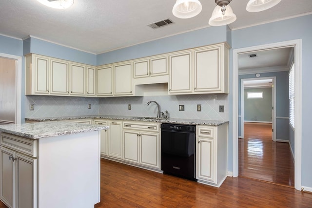 kitchen with visible vents, dishwasher, dark wood-style flooring, cream cabinets, and a sink