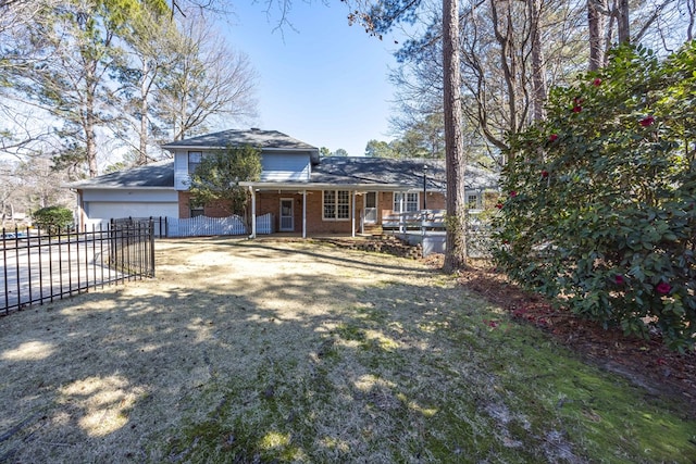 view of front facade featuring driveway, covered porch, fence, and brick siding