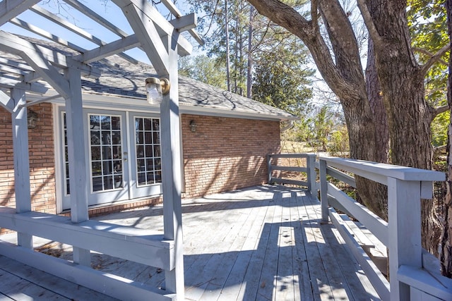 deck featuring french doors and a pergola