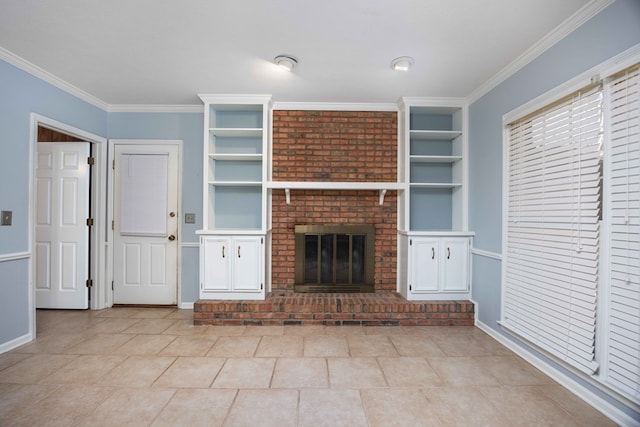 unfurnished living room featuring built in features, a brick fireplace, ornamental molding, and baseboards