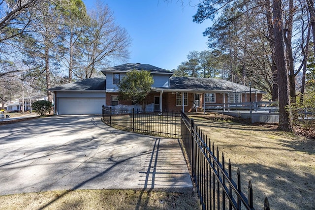 7015 Widgeon Dr, Midland, GA 31820 - view of front of house featuring concrete driveway, brick siding, an attached garage, and a porch