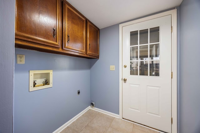 laundry area featuring light tile patterned floors, hookup for a washing machine, cabinet space, hookup for an electric dryer, and baseboards