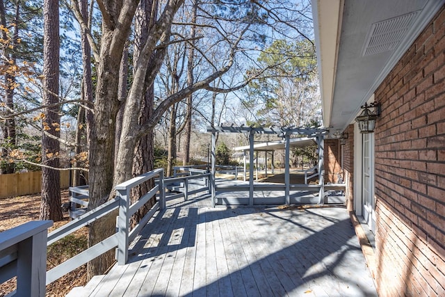 deck with fence and a pergola