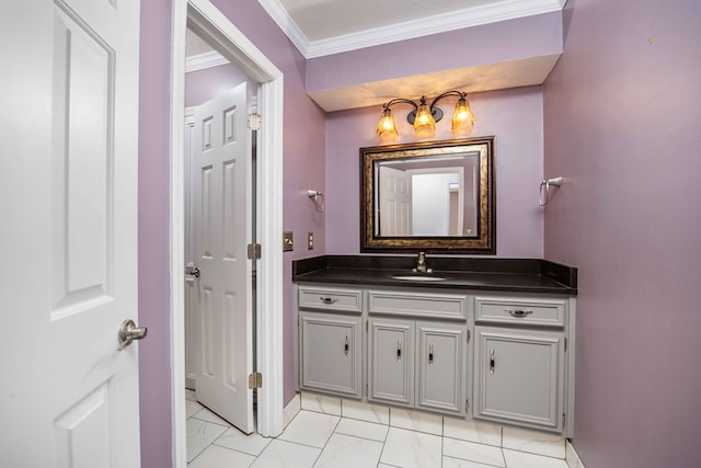 bathroom with ornamental molding, marble finish floor, and vanity