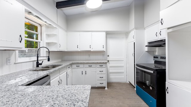 kitchen with white cabinets, appliances with stainless steel finishes, light hardwood / wood-style flooring, and sink