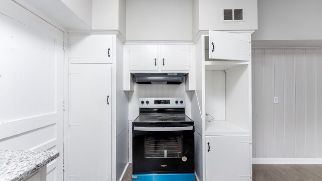 kitchen featuring light stone countertops, white cabinets, stainless steel range with electric stovetop, and hardwood / wood-style flooring