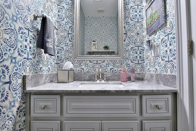 bathroom featuring visible vents and vanity