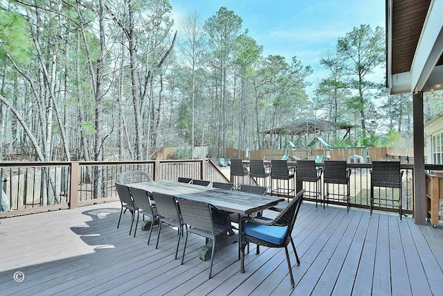 wooden deck with outdoor dining area