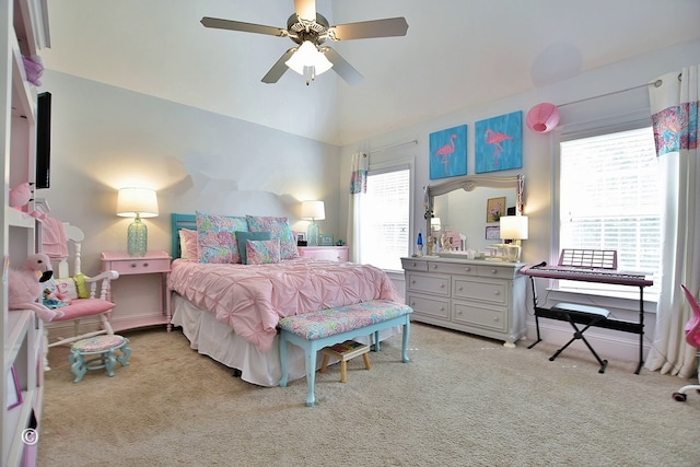 bedroom featuring vaulted ceiling, ceiling fan, and light colored carpet