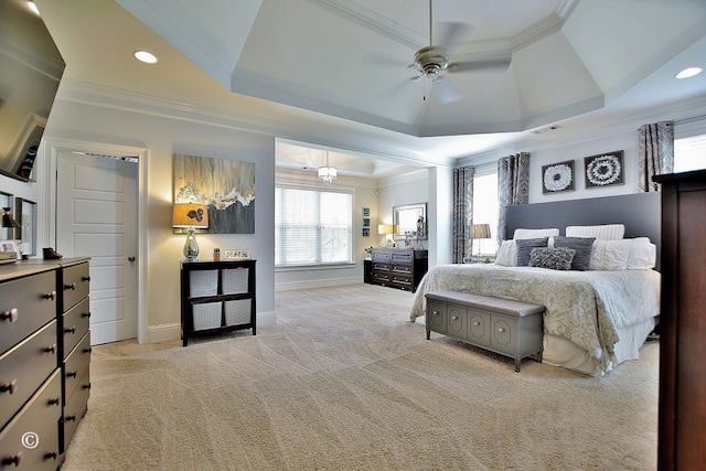 bedroom featuring visible vents, a raised ceiling, baseboards, light colored carpet, and ornamental molding