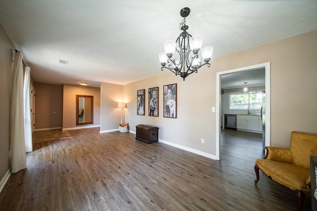 6801 Buckeye Way, Columbus, GA 31904 - unfurnished room with wood finished floors and a chandelier