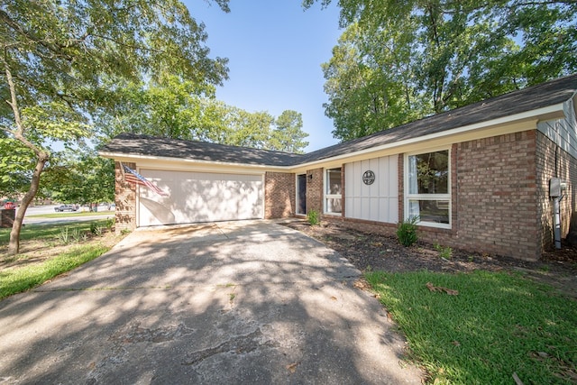 6801 Buckeye Way, Columbus, GA 31904 - ranch-style house with brick siding, an attached garage, driveway, and board and batten siding