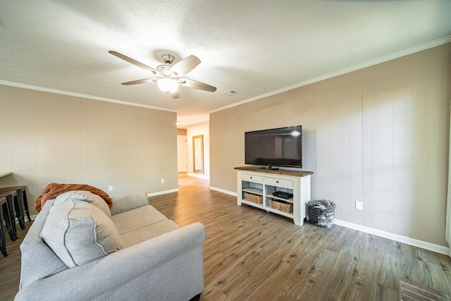 6801 Buckeye Way, Columbus, GA 31904 - living room with wood finished floors, a ceiling fan, and crown molding