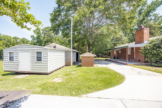 8085 Ga Highway 0219, Hamilton, GA 31811 - view of property exterior featuring a yard, a chimney, driveway, and view of wooded area