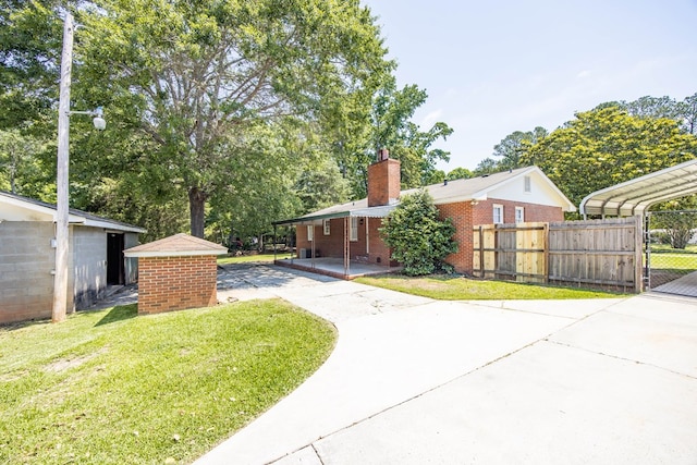 8085 Ga Highway 0219, Hamilton, GA 31811 - view of front of house featuring driveway, a chimney, and brick siding