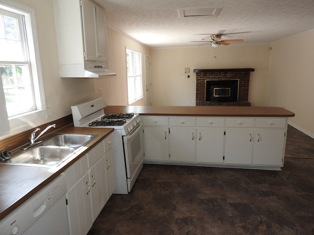 1346 22nd St, Columbus, GA 31901 - kitchen with white appliances, healthy amount of natural light, under cabinet range hood, white cabinets, and ornamental molding