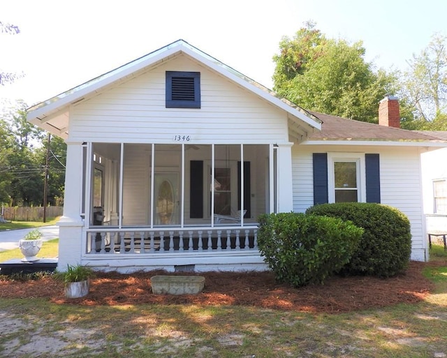 1346 22nd St, Columbus, GA 31901 - view of front facade featuring a sunroom and a chimney
