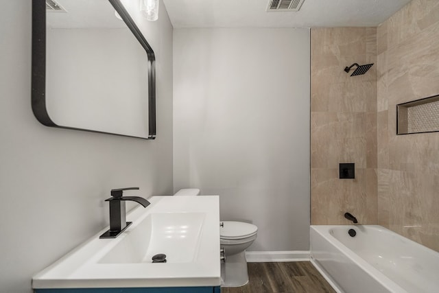 2906 Kent Dr, Phenix City, AL 36870 - bathroom with wood finished floors, vanity, and bathing tub / shower combination