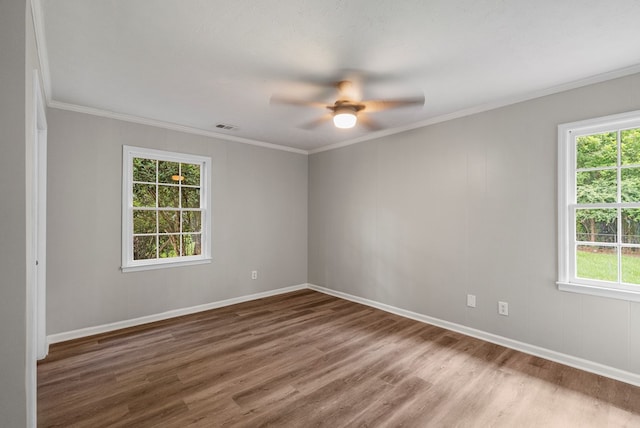 2906 Kent Dr, Phenix City, AL 36870 - spare room with wood finished floors, ceiling fan, healthy amount of natural light, and crown molding