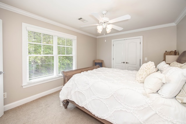 1438 Grove Park Dr Unit 8B, Columbus, GA 31904 - bedroom with ornamental molding, a closet, baseboards, light carpet, and a ceiling fan