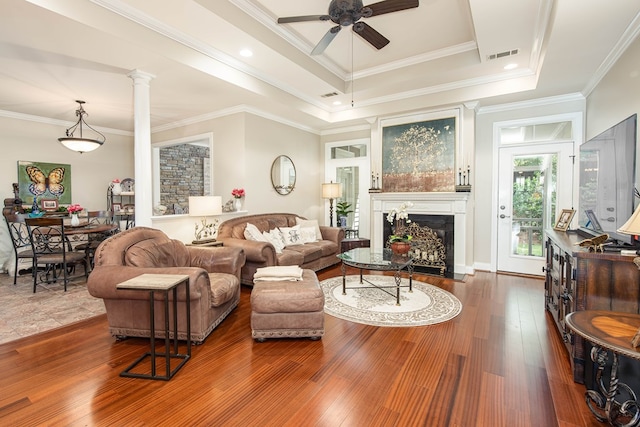 1438 Grove Park Dr Unit 8B, Columbus, GA 31904 - living room featuring a ceiling fan, a fireplace with flush hearth, ornate columns, crown molding, and wood finished floors