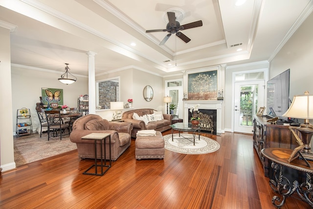 1438 Grove Park Dr Unit 8B, Columbus, GA 31904 - living area featuring ceiling fan, a fireplace, a tray ceiling, wood finished floors, and crown molding