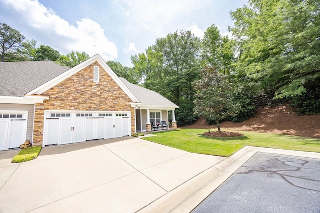 1438 Grove Park Dr Unit 8B, Columbus, GA 31904 - view of front of property with stone siding, a front yard, driveway, a garage, and roof with shingles