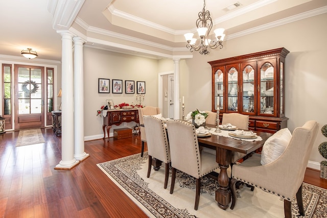 1438 Grove Park Dr Unit 8B, Columbus, GA 31904 - dining area with ornate columns, crown molding, hardwood / wood-style flooring, baseboards, and a chandelier