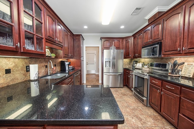 1438 Grove Park Dr Unit 8B, Columbus, GA 31904 - kitchen featuring appliances with stainless steel finishes, a sink, ornamental molding, glass insert cabinets, and tasteful backsplash