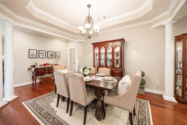 1438 Grove Park Dr Unit 8B, Columbus, GA 31904 - dining space with decorative columns, a tray ceiling, wood finished floors, and crown molding