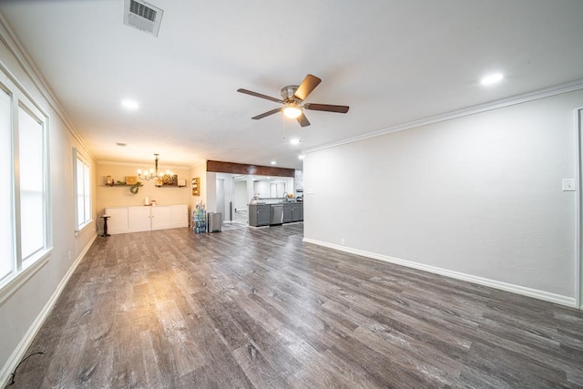 unfurnished living room with ceiling fan with notable chandelier, dark wood-type flooring, and crown molding