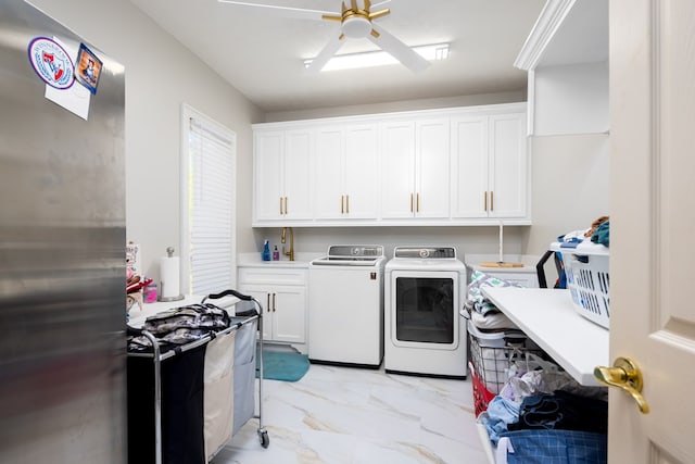 laundry area with washer and clothes dryer, ceiling fan, and cabinets