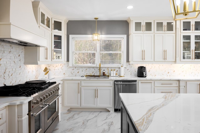 5410 River Oak Way, Phenix City, AL 36867 - kitchen featuring custom exhaust hood, appliances with stainless steel finishes, a sink, backsplash, and decorative light fixtures