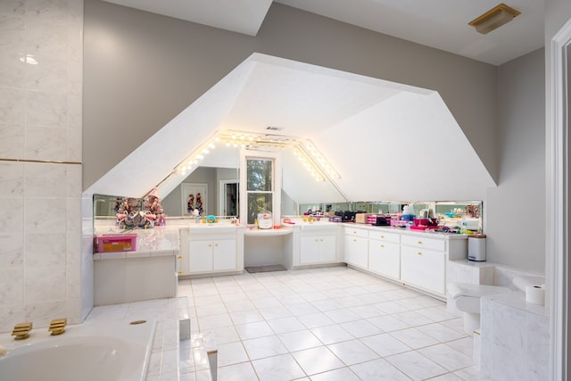 5410 River Oak Way, Phenix City, AL 36867 - full bath with vanity, a garden tub, vaulted ceiling, and tile patterned flooring